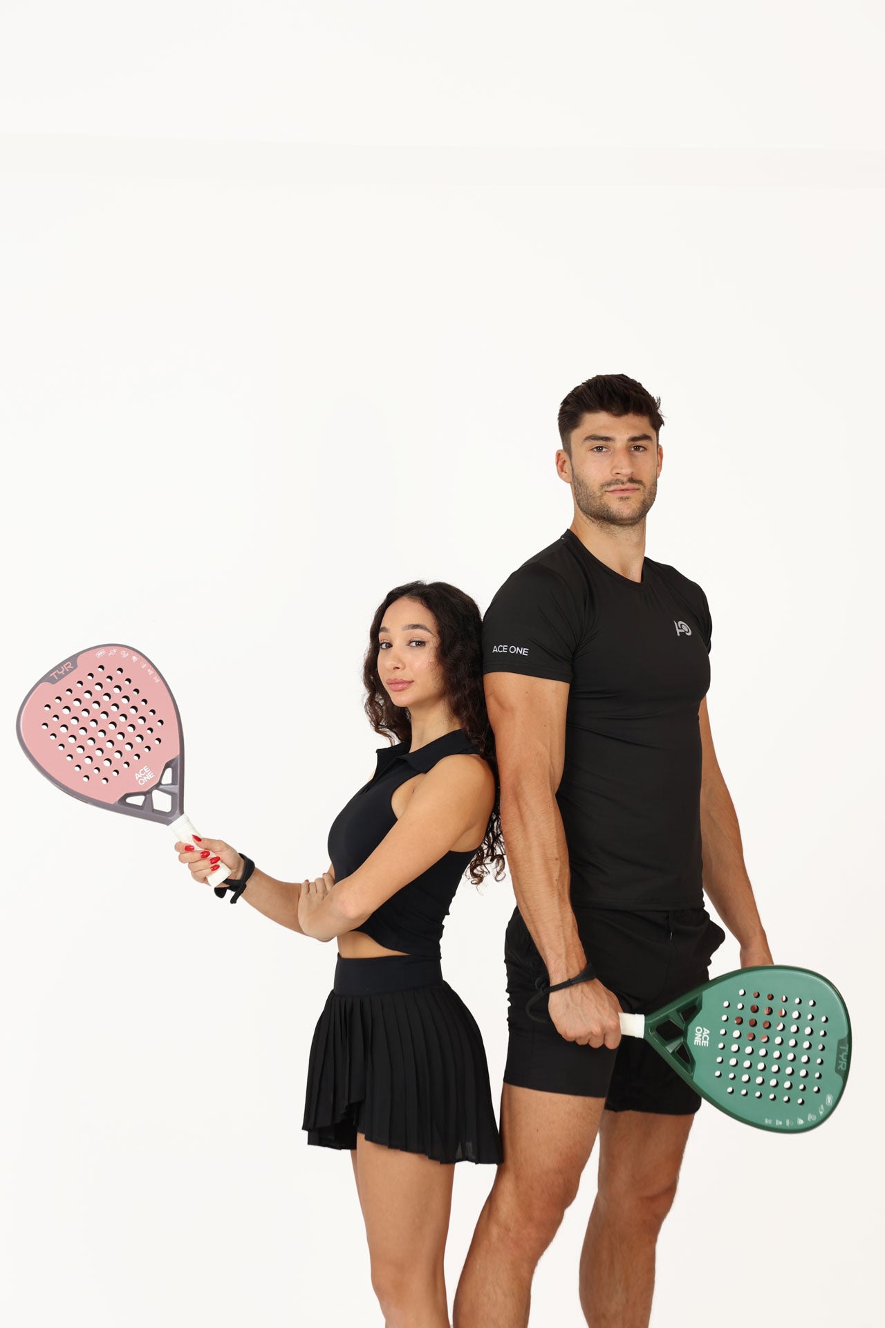 Player holding ACE ONE TŸR Pink padel racket