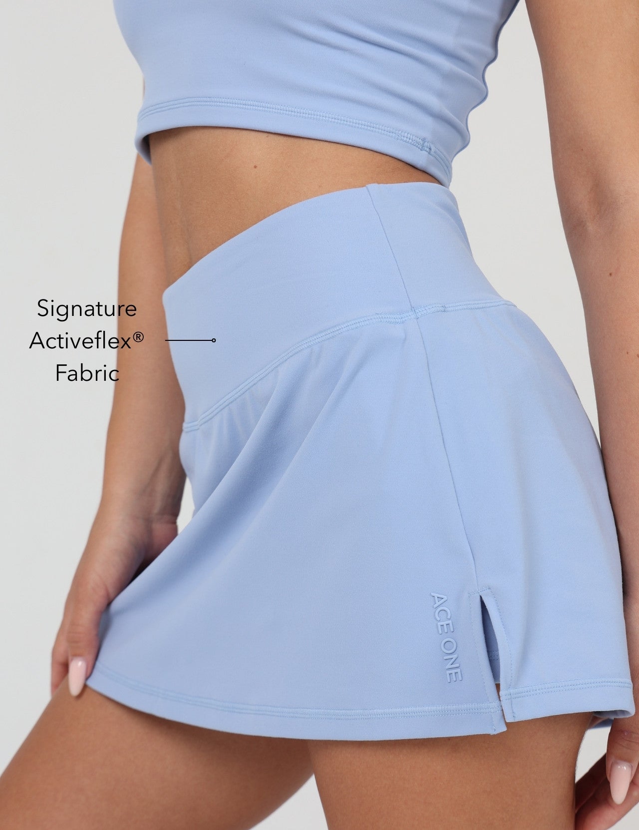 Ace One Women's blue active skort – lightweight sports skirt with built-in shorts, ideal for padel and tennis.