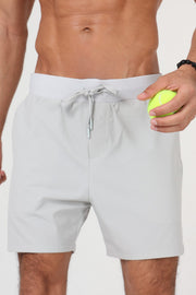 Man wearing ACE ONE grey padel short on court